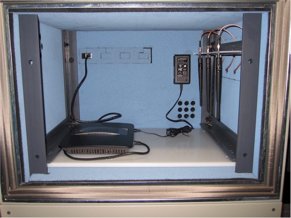 Router under test inside the upper test chamber