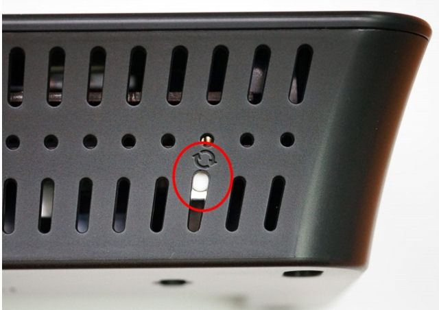 Securifi Almond+ reset button is located beneath the third rear air vent on the top left of the case