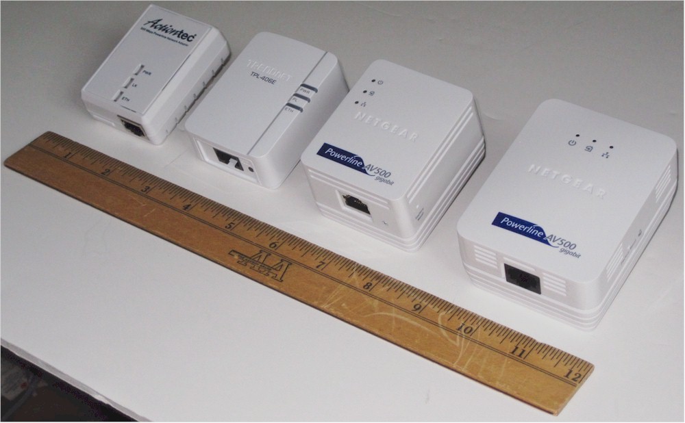Adapter comparison size, left to right, Actiontec PWR500, TRENDnet TPL-406E2K, NETGEAR XAVB5101, NETGEAR XAVB5001